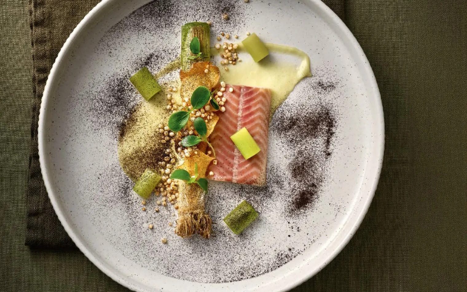 Fine-dining dish on a speckled porcelain plate