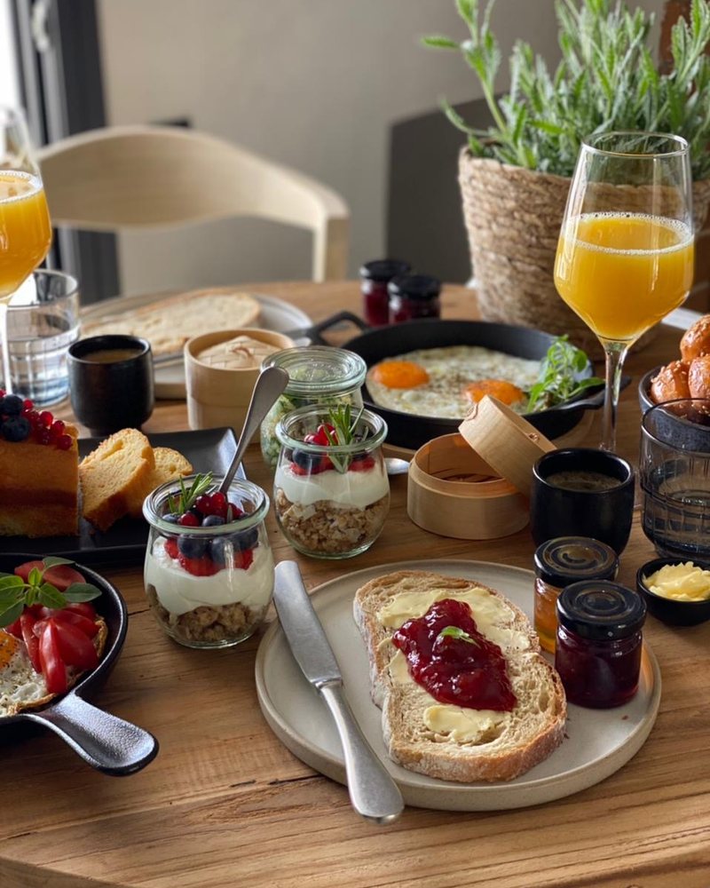Breakfast with fresh juices and jars