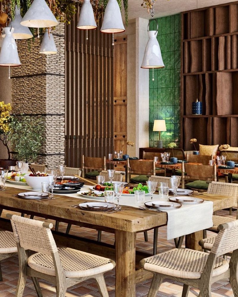 Restaurant with long tables and pendant lights